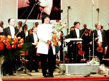 Marat Bisengaliev receives flowers after concert with London's Royal Philharmonic.