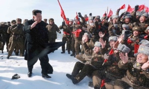 Kim Jong-Un waves to cheering Korean People’s Army pilots on Mount Paektu. Photograph: KNS/AFP/Getty Images
